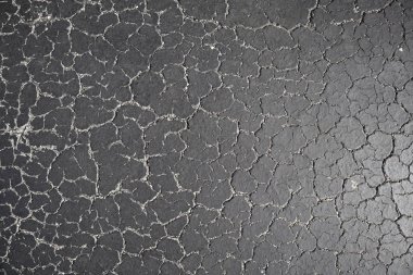 Eski yol arka plan - gri yüzeyi asfalt doku yakın kadar Miami şehir sokak kırık. siyah kırık asfalt. taş arka plan