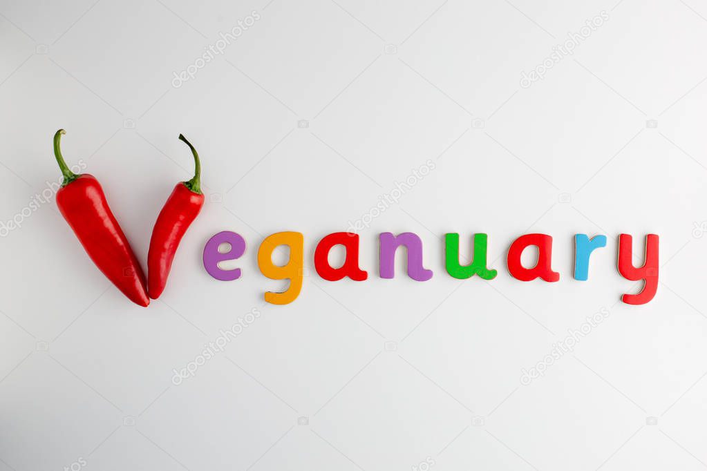 Veganuary word made from childish lettering and v formed from red chillies