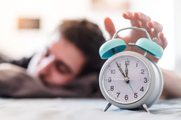 White Alarm Clock Morning Young Man Wakes — Stock Photo, Image