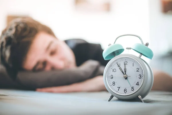 White Alarm Clock Morning Young Man Sleeps Background — Stock Photo, Image