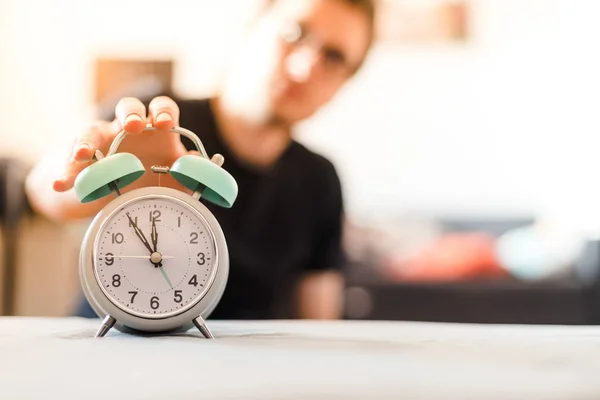 Man Pushing Alarm Clock Sunshine Morning Blurry Background — Stock Photo, Image