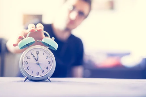 Man Pushing Alarm Clock Sunshine Morning Blurry Background — Stock Photo, Image