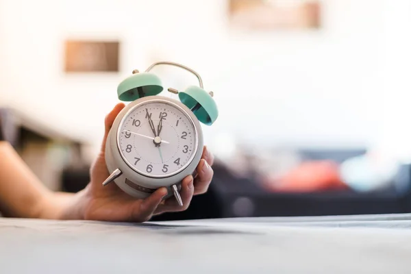 Man Holding Alarm Clock Sunshine Morning Blurry Background — Stock Photo, Image