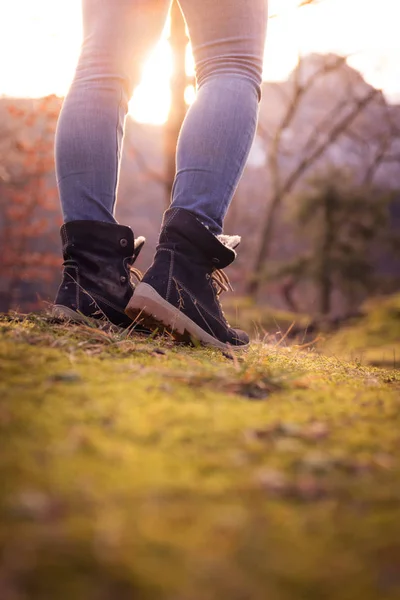 stock image Boots of a young woman, cutout, outdoors in timberland, autumn