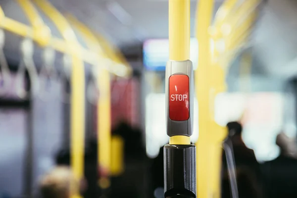 Stop Button in a bus, public transport, blurry