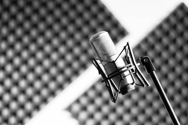 Professional studio microphone in a recording studio, sound insulation in the blurry background