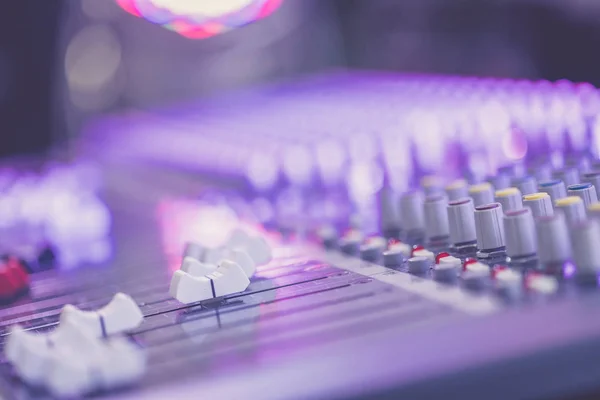 Professional music production in a sound recording studio, mixer desk