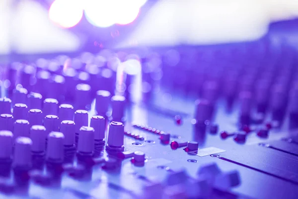 Professional music production in a sound recording studio, mixer desk