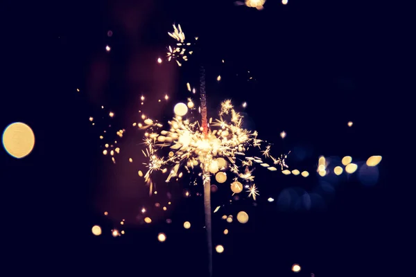 Smiling Girl Holding Sparkler Her Hand Indoor Lights Background — Stock Photo, Image