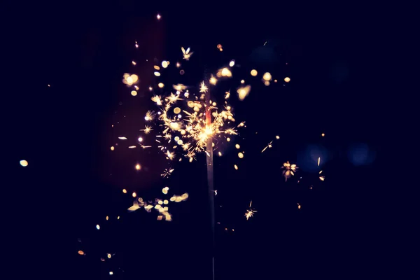 Smiling Girl Holding Sparkler Her Hand Indoor Lights Background — Stock Photo, Image