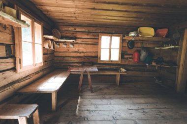 Mountain hut in Austria: rustic wooden interior clipart