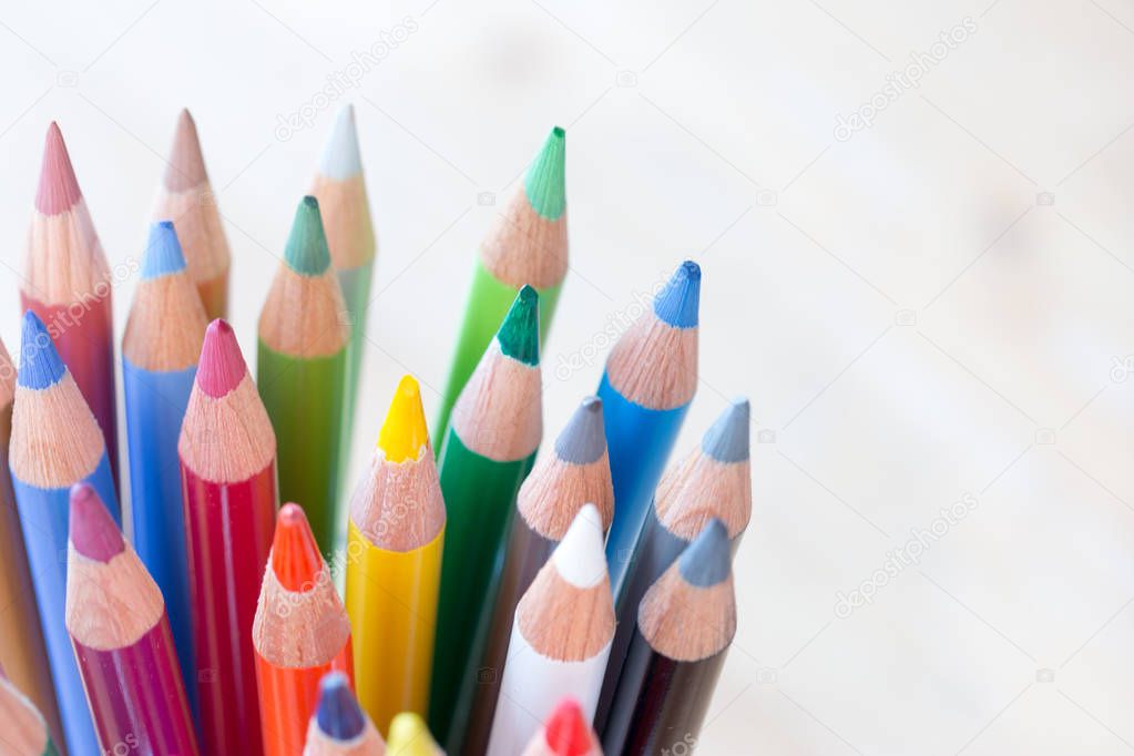 Creativity: Colored pencils in a can on rustic wooden table, whi