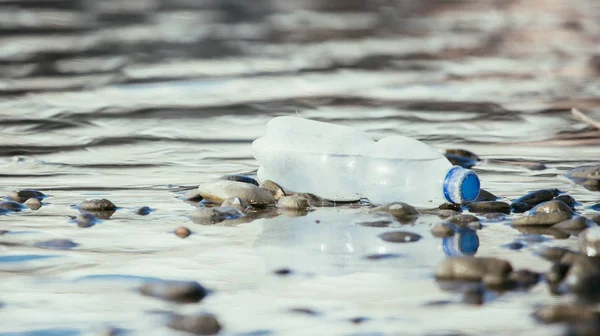 Environmental pollution: plastic bottle on the beach — Stock Photo, Image