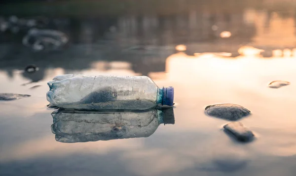 Environmental pollution: plastic bottle on the beach — Stock Photo, Image