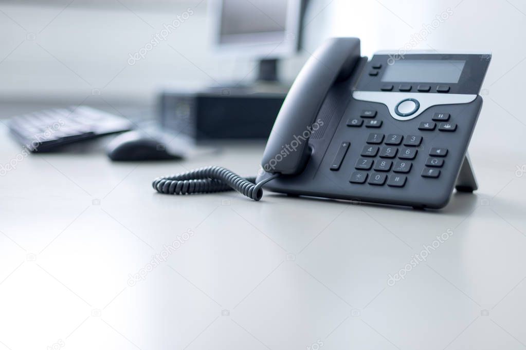 Classical black telephone in the office, customer support and te