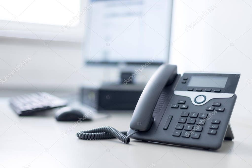 Classical black telephone in the office, customer support and te
