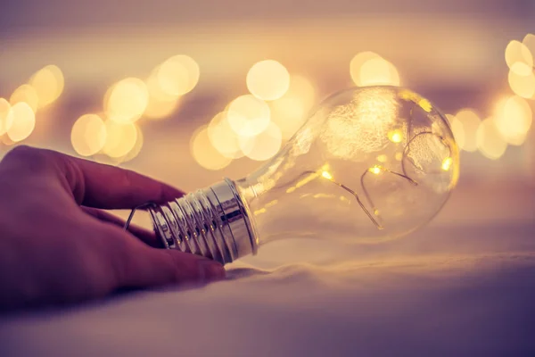 Ideas and innovation: Light bulb with LEDs is lying in the bed,