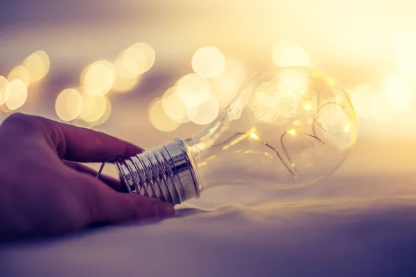 Ideas and innovation: Light bulb with LEDs is lying in the bed,