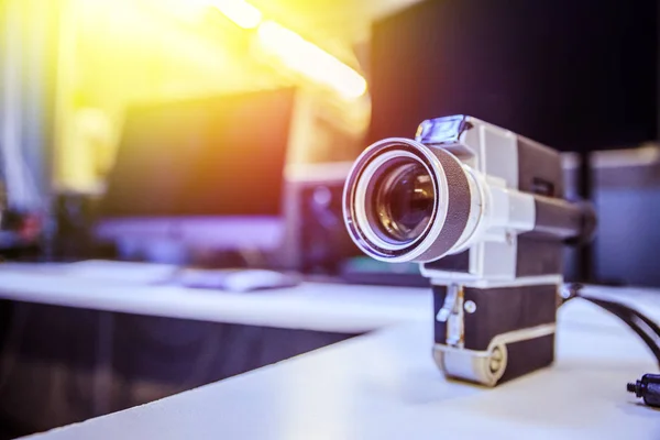 Movie production: vintage old movie camera on a desk, cutting ro