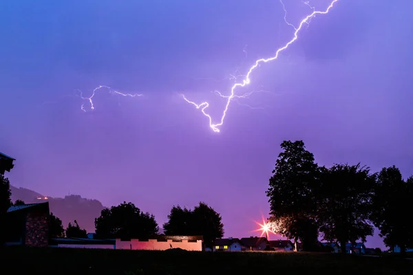 Thunderstorm in the night: Lightning on the colored sky. Global — Stock Photo, Image