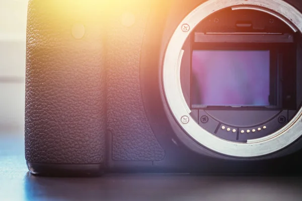 Camera Sensor: close up picture of a professional reflex camera.