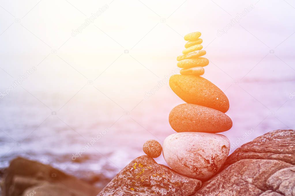 Balance, relaxation and wellness: Stone cairn outside, ocean in 