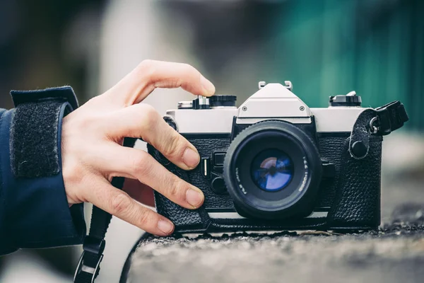 Retro vintage photography camera outdoors, stony wall — Stock Photo, Image