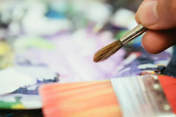 Painting artwork: paint brushes on painting background — Stock Photo, Image