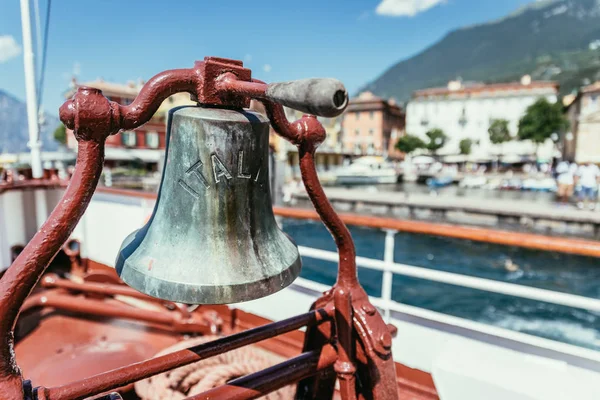 Boat tour: Boat bow with boat bell, view over azure blue water,