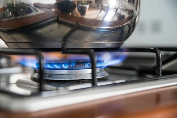 Cooking with gas, water pot in kitchen — Stock Photo, Image