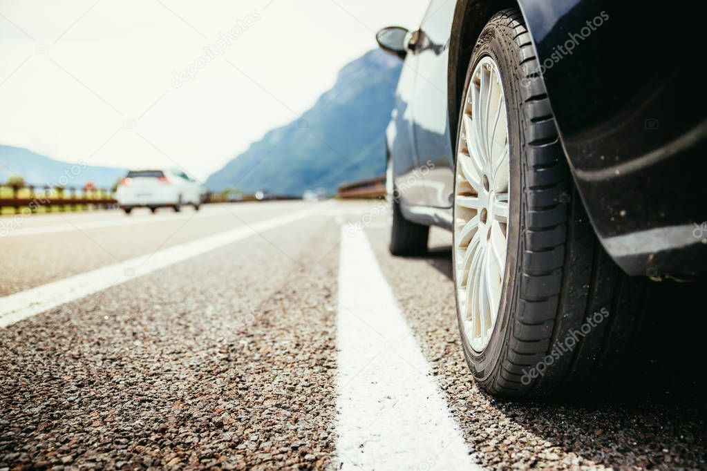 Car is standing on the breakdown lane, asphalt and tyre, Italy