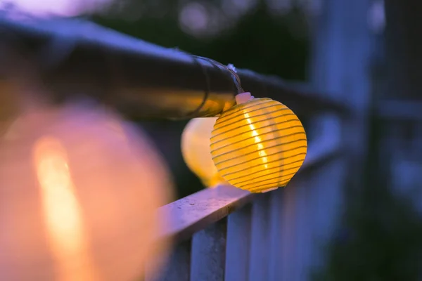 Lampions in the night: Garden party in summer