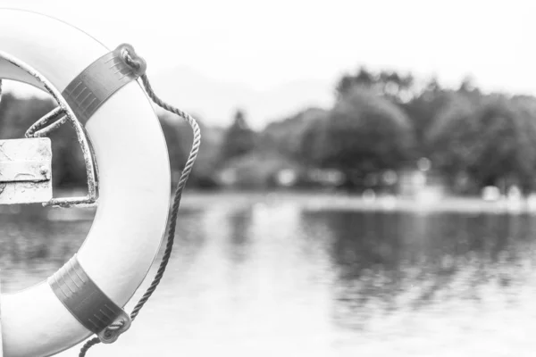 Safety buoy or lifesaver at a swimming lake — Stock Photo, Image