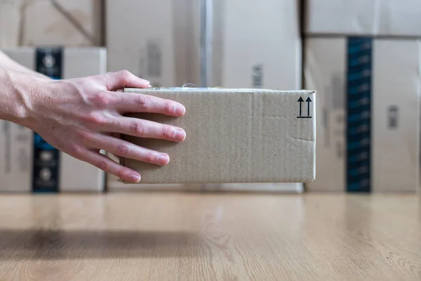 Cardboard box package, shipping concept: Delivering a parcel