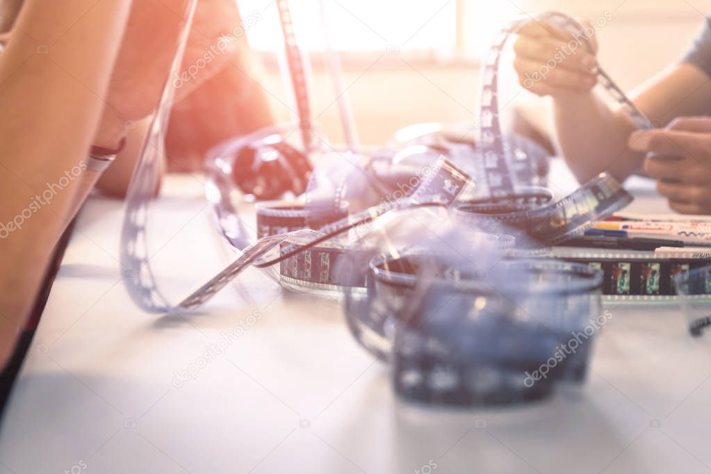 Cinema film reel on a cutting table: Filmmaker is working with v