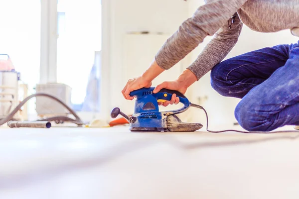 Renovating at home: sander tool for refreshing and grinding the — Stock Image Renovating at home: sander tool for refreshing and grinding the Royalty Free Stock Images