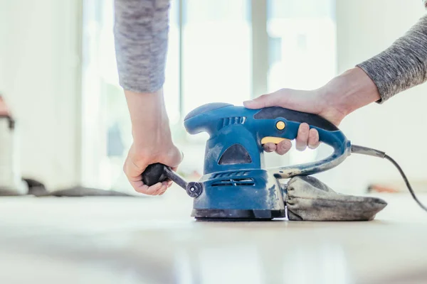 Renovating at home: sander tool for refreshing and grinding the — Stock Image Renovating at home: sander tool for refreshing and grinding the Stock Image