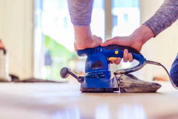 Renovating at home: sander tool for refreshing and grinding the — Stock Image Renovating at home: sander tool for refreshing and grinding the Stock Photo