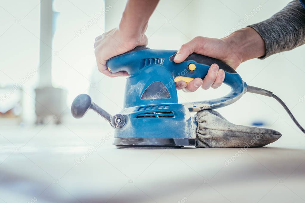 Renovating at home: sander tool for refreshing and grinding the 