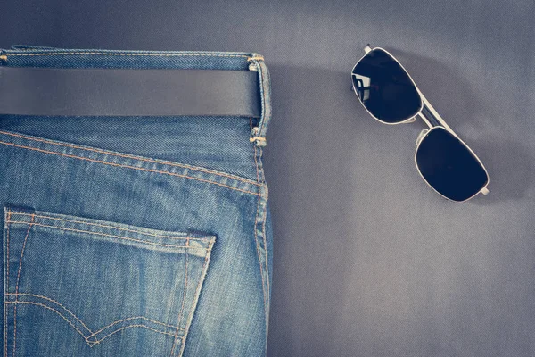 Blue Jeans Black Sunglasses Background Close — Stock Photo, Image