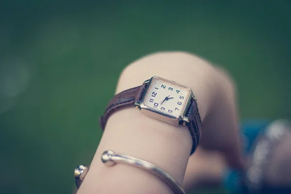 close up of female hand with watch