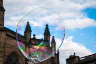 Colored soap bubble flying in town