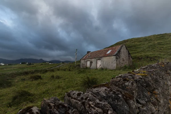 house on green hill in the mountains