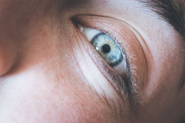 blue eye of beautiful young girl