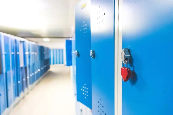 Blue cage lockers in a gym