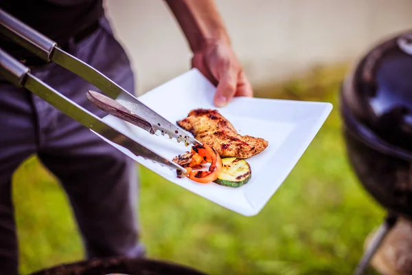 man with barbecue in park outdoor