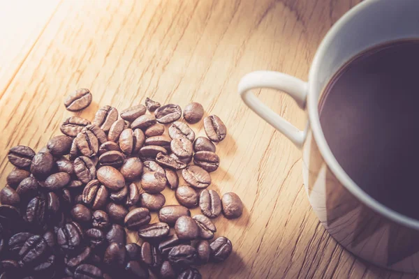 Coffee cup and beans on a white background.