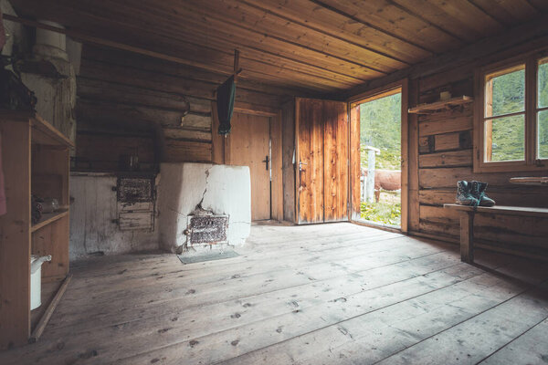 Interior of an old rustic abandoned alpine chalet in Austria