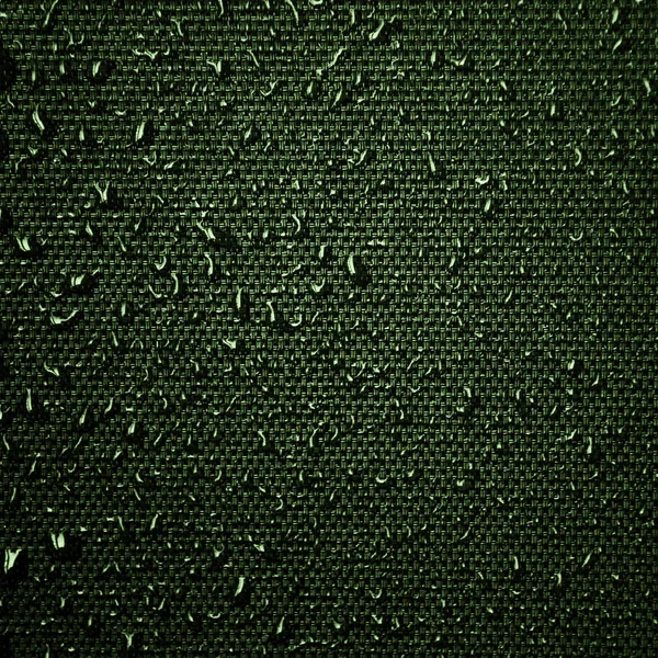 Water drops on the fabric texture. wet textile texture. cloth with water drops. moist fabric pattern.