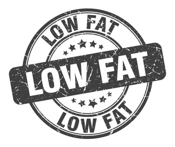 Timbro basso contenuto di grassi. basso grasso rotondo grunge segno. basso contenuto di grassi — Vettoriale Stock
